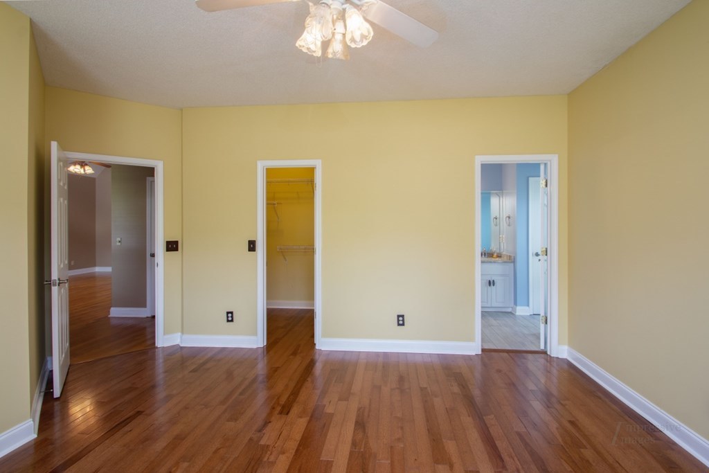 885 Jenkins Road, Unit 14 Forsyth, GA 31029 - Photo 18 of 33 wooden floor in an empty room with a gallery
