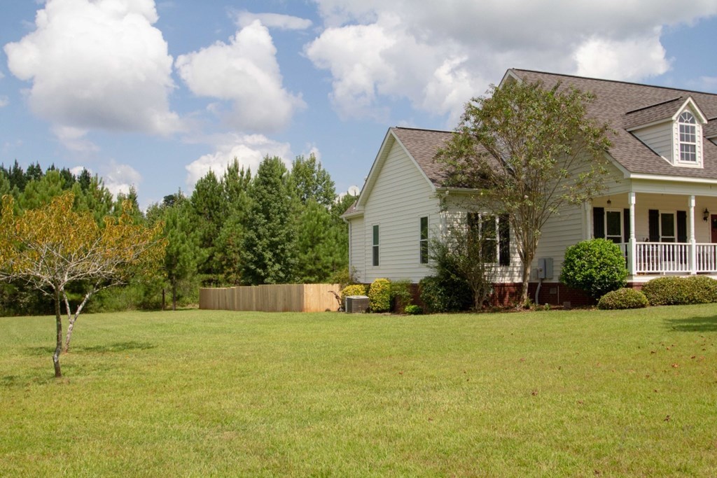 885 Jenkins Road, Unit 14 Forsyth, GA 31029 - Photo 25 of 33 a front view of house with yard and trees in the background