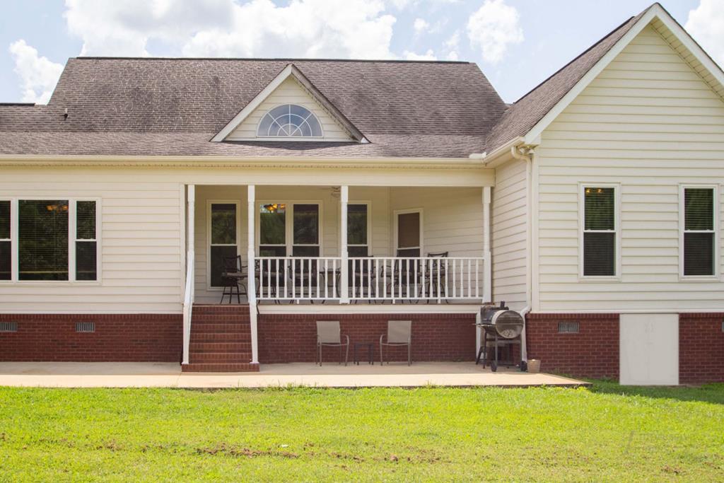 885 Jenkins Road, Unit 14 Forsyth, GA 31029 - Photo 29 of 33 a view of a house with a yard and sitting area