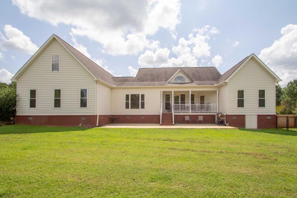885 Jenkins Road, Unit 14 Forsyth, GA 31029 - Photo 30 of 33 a view of a yard in front of a house with a large tree
