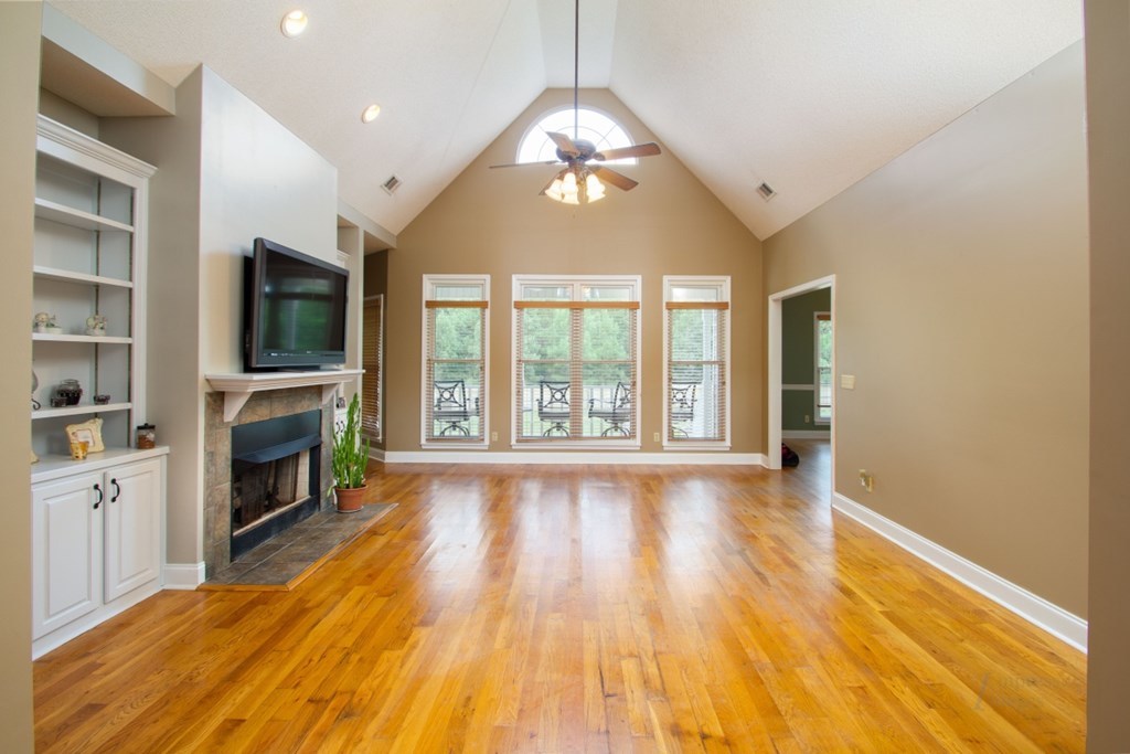 885 Jenkins Road, Unit 14 Forsyth, GA 31029 - Photo 5 of 33 a view of an empty room with a fireplace and a window