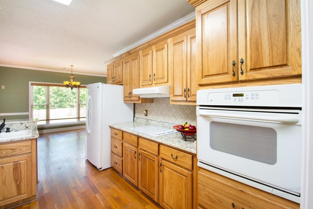 885 Jenkins Road, Unit 14 Forsyth, GA 31029 - Photo 8 of 33 a kitchen with stainless steel appliances a stove sink and cabinets