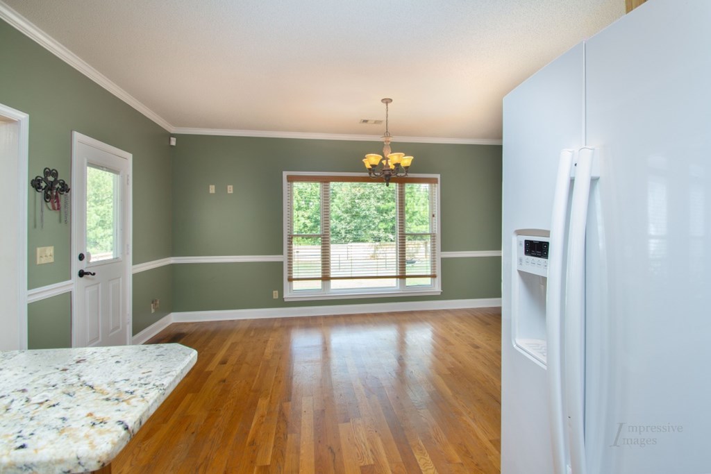885 Jenkins Road, Unit 14 Forsyth, GA 31029 - Photo 9 of 33 a view of a bedroom with wooden floor and bedroom
