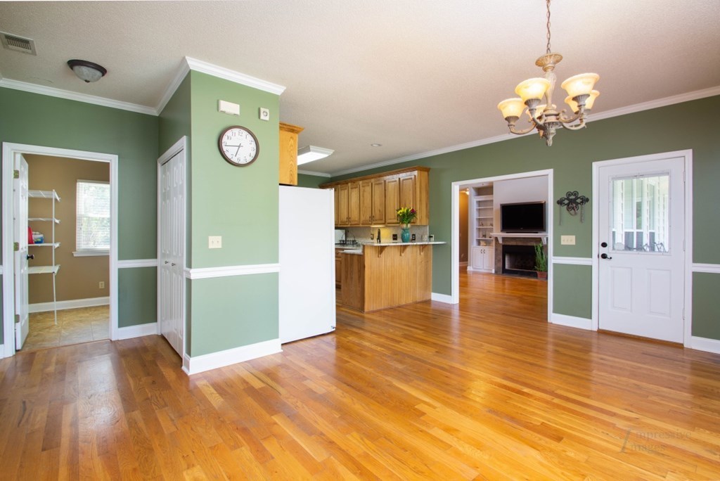 885 Jenkins Road, Unit 14 Forsyth, GA 31029 - Photo 10 of 33 a view of a kitchen with a microwave and wooden floor