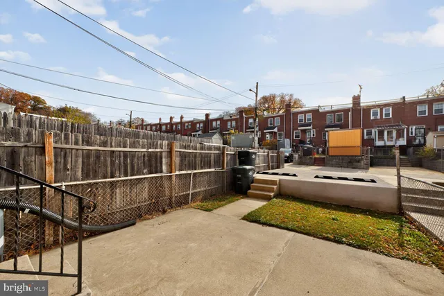 a view of a terrace with wooden floor and city view