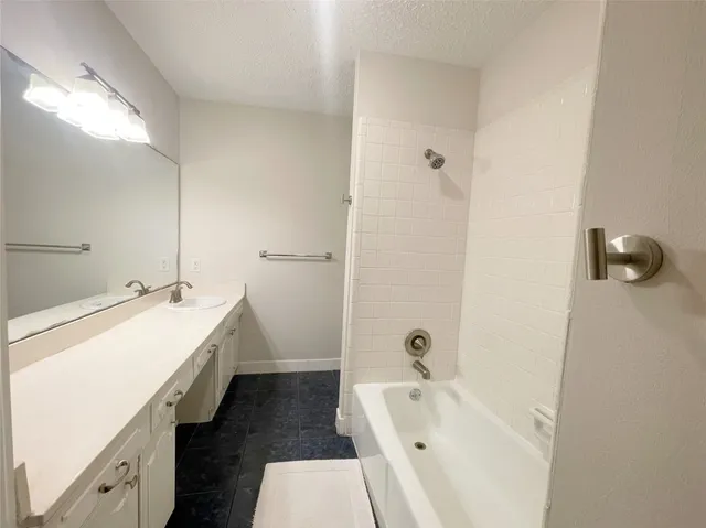 a bathroom with a sink and a bathtub