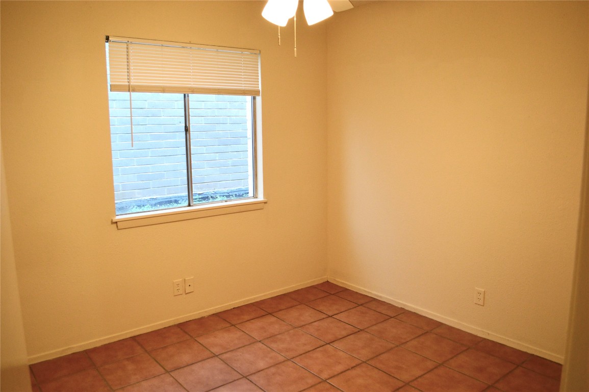 2610 Salado Street, Unit 110 Austin, TX 78705 - Photo 14 of 20 an empty room with a window
