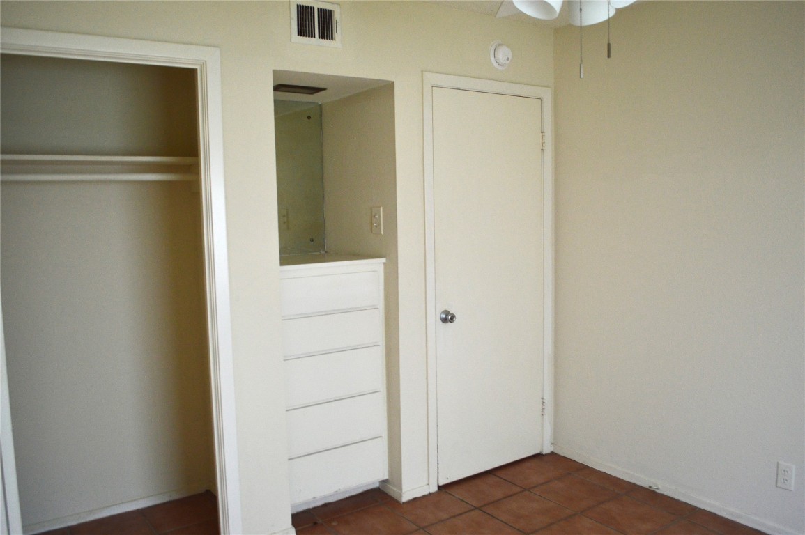 2610 Salado Street, Unit 110 Austin, TX 78705 - Photo 16 of 20 a view of a hallway with wooden floor