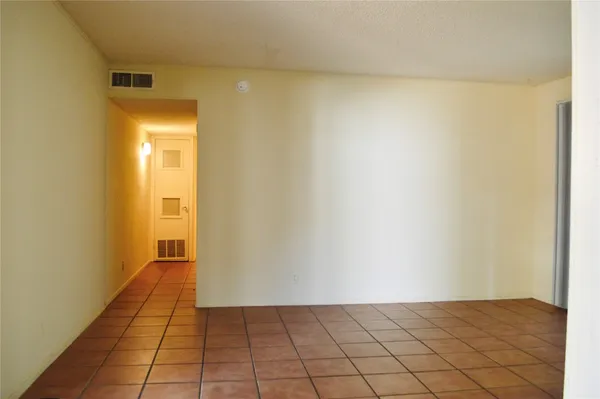 a view of a kitchen cabinets and wooden floor