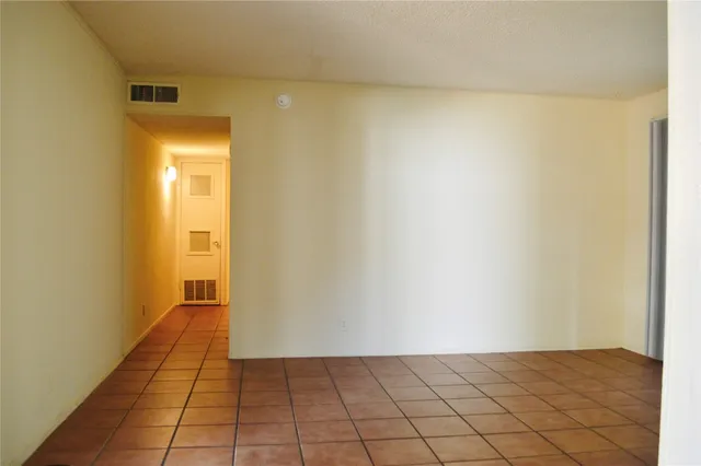 a view of a kitchen cabinets and wooden floor