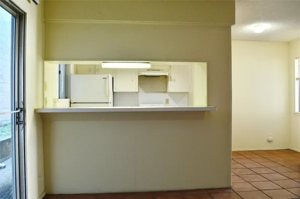 a picture of a room with a table and chairs