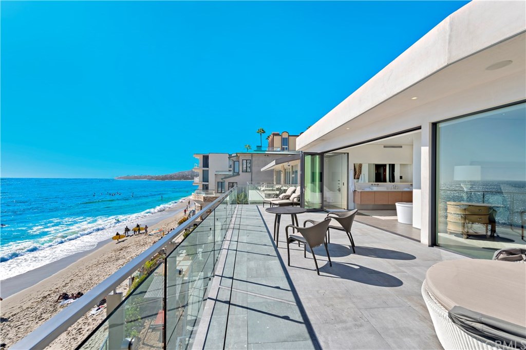 992 Ocean Front Laguna Beach, CA 92651 - Photo 19 of 33 Deck off master bedroom with sand below.