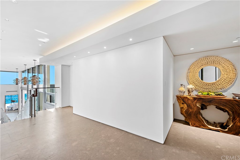992 Ocean Front Laguna Beach, CA 92651 - Photo 5 of 33 Foyer and stairs down to mid level. Elevator on the right before staircase. Master bedroom straight ahead.