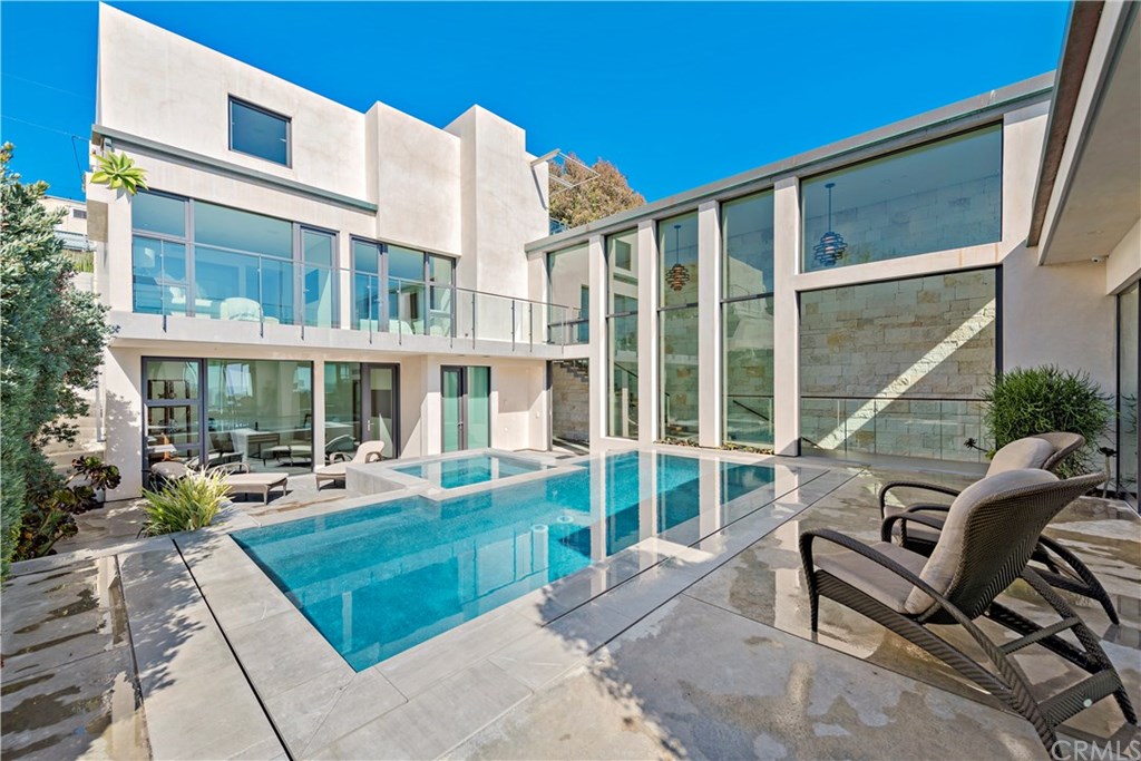 992 Ocean Front Laguna Beach, CA 92651 - Photo 9 of 33 Pool with view of guest bedrooms and office.