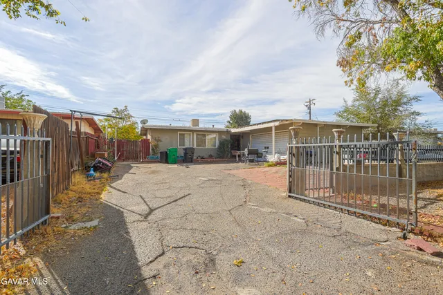 a view of a house with a snow in the yard