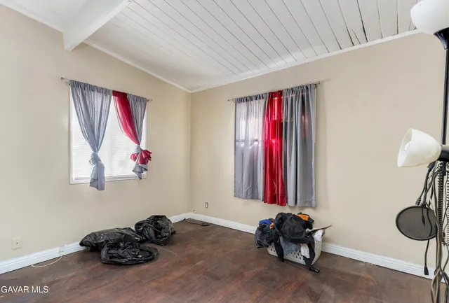 a bedroom with furniture and a bed