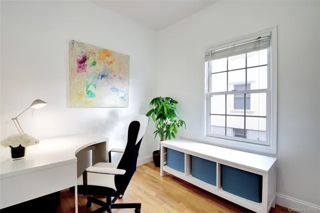 a view of a livingroom with furniture and wooden floor