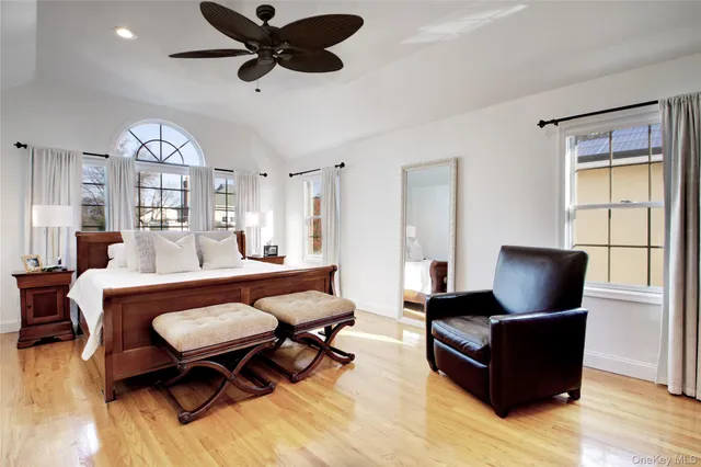 a living room with furniture a rug and a flat screen tv