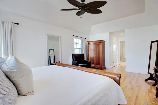 a bathroom with a bathtub sink and mirror