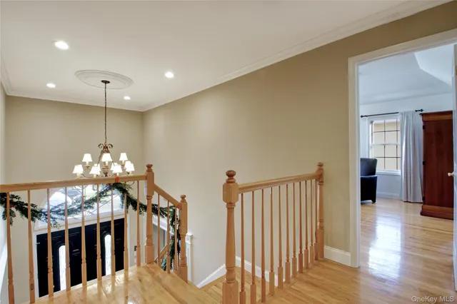 a living room with furniture and a view of kitchen