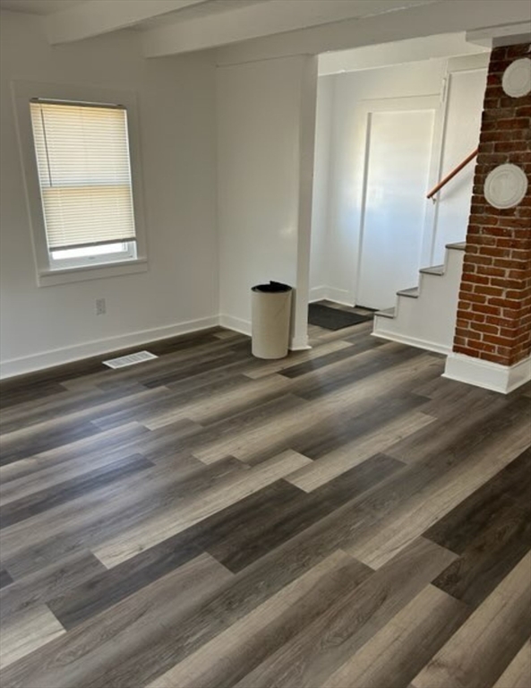 87 North High Street, Unit A Derry, NH 03038 - Photo 4 of 9 a view of empty room and window