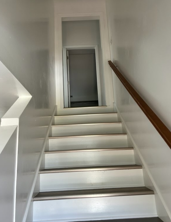 87 North High Street, Unit A Derry, NH 03038 - Photo 8 of 9 a view of staircase with white walls and a window