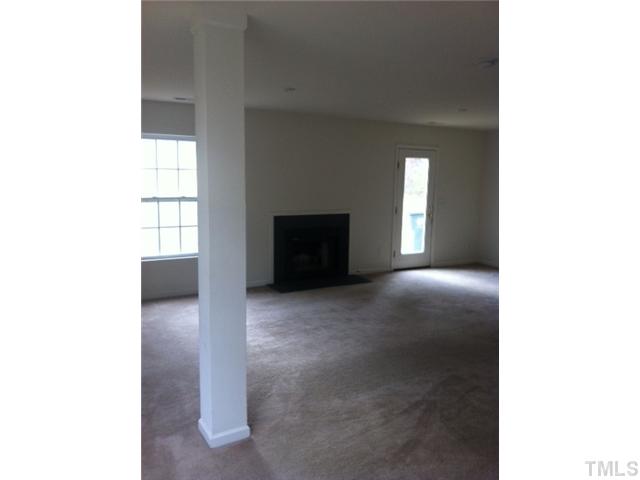 910 Ujamaa Drive Raleigh, NC 27610 - Photo 3 of 6 a view of a livingroom with furniture and window