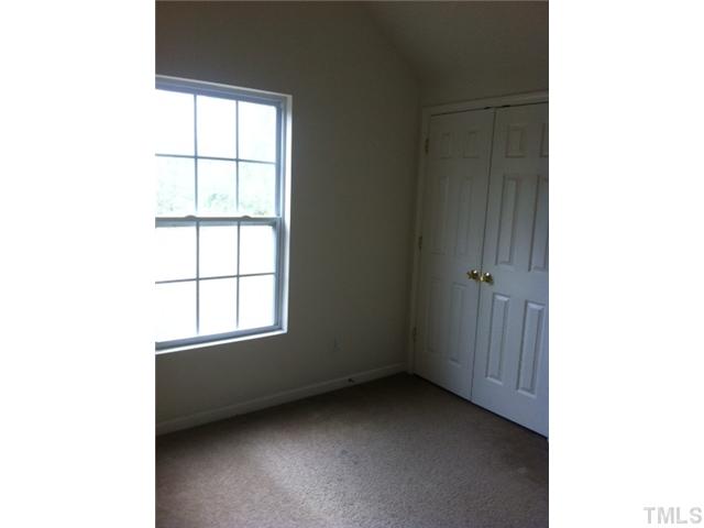 910 Ujamaa Drive Raleigh, NC 27610 - Photo 6 of 6 a view of an empty room with a window