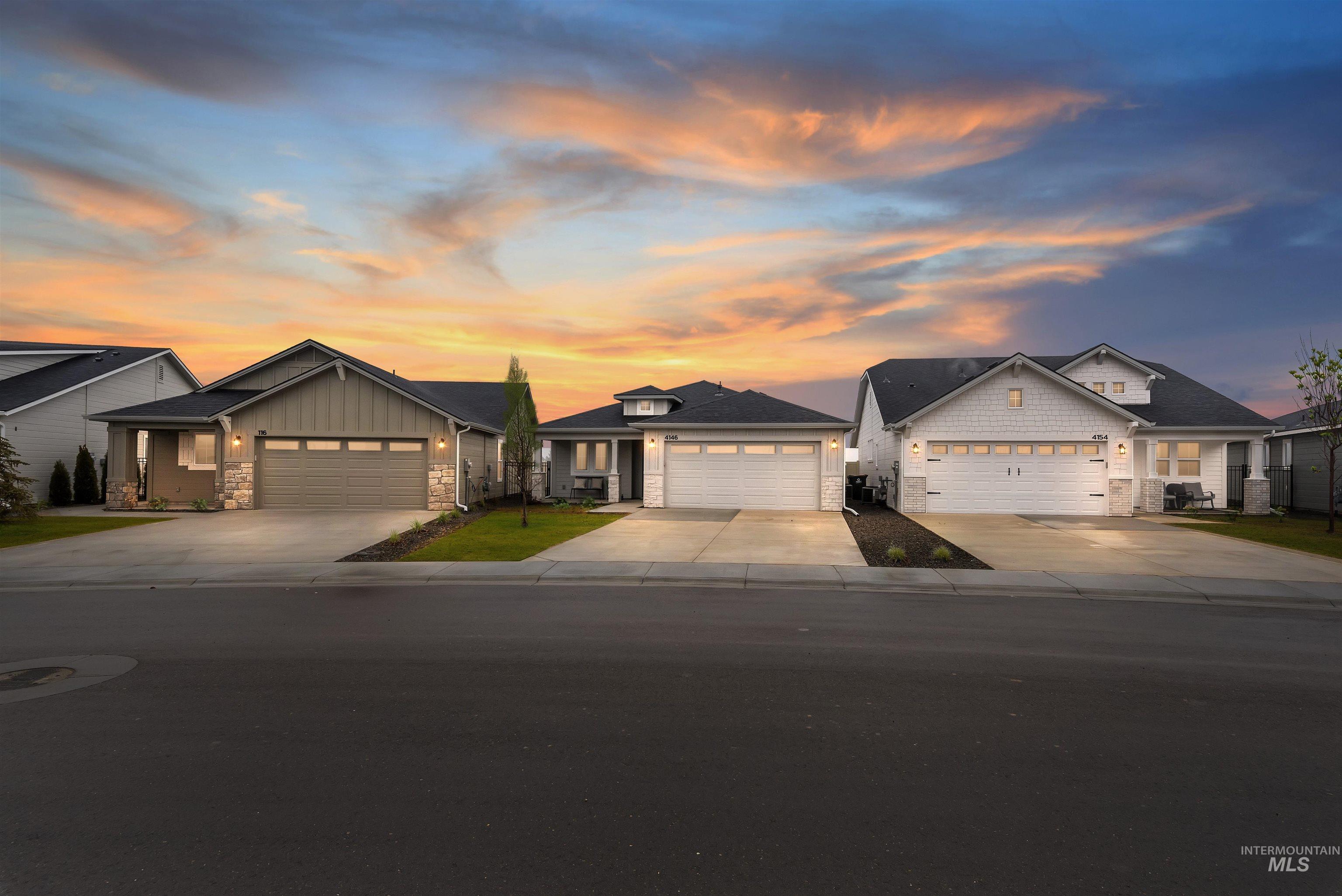 1700 East Hadler Street Meridian, ID 83642 - Photo 19 of 25 The central residence features a light-toned exterior with shingle siding and a prominent two-car garage