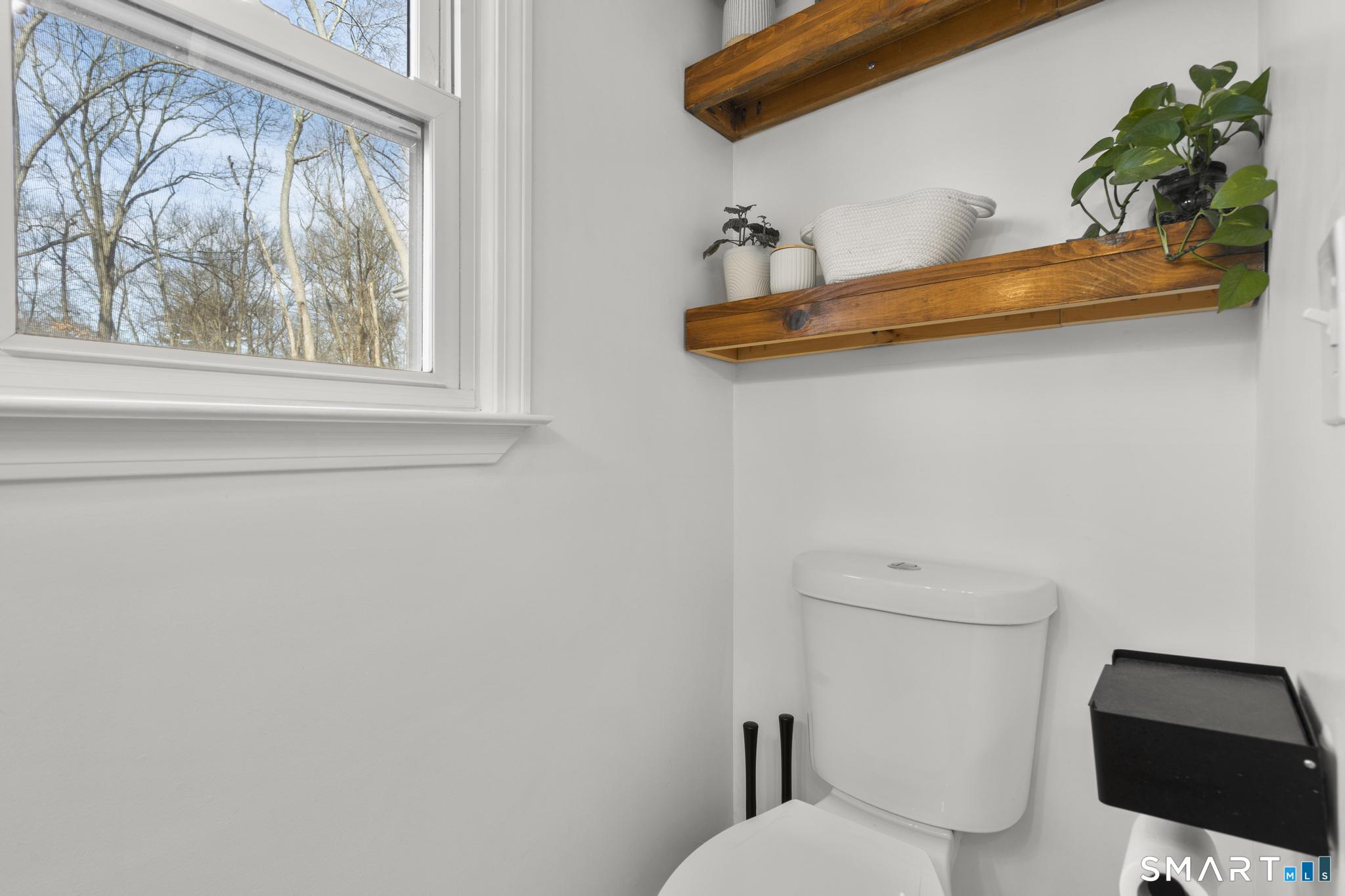 97 Racebrook Road Meriden, CT 06451 - Photo 11 of 35 a bathroom with a toilet a sink and a window