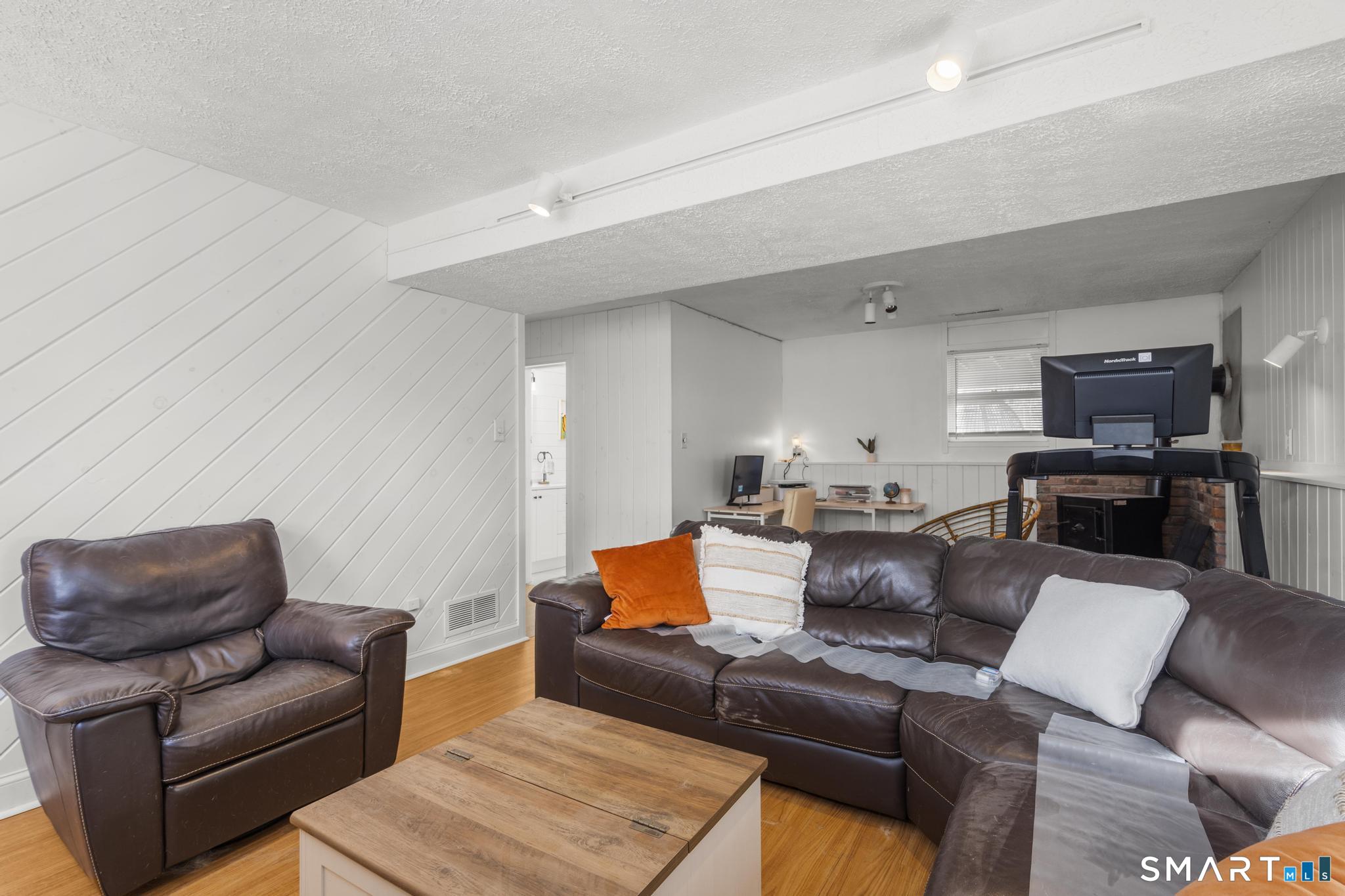 97 Racebrook Road Meriden, CT 06451 - Photo 17 of 35 a living room with furniture and a couch