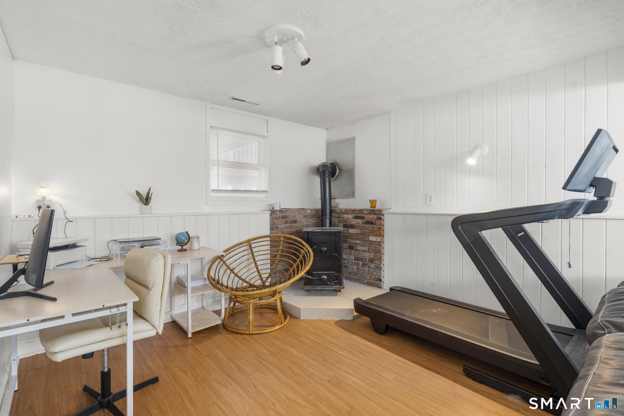 97 Racebrook Road Meriden, CT 06451 - Photo 18 of 35 a room with table chairs and a wooden floor