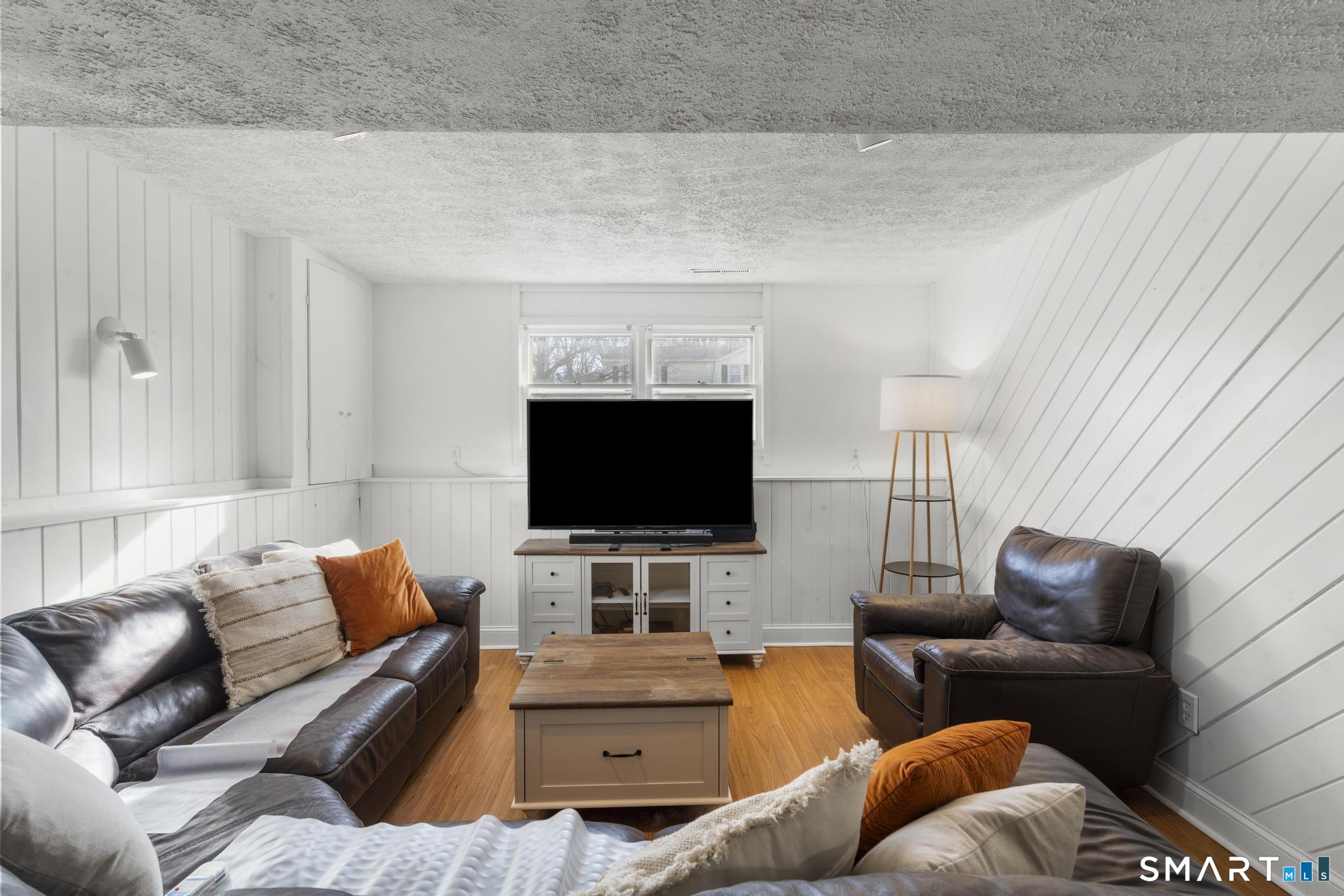97 Racebrook Road Meriden, CT 06451 - Photo 19 of 35 a living room with furniture and a flat screen tv