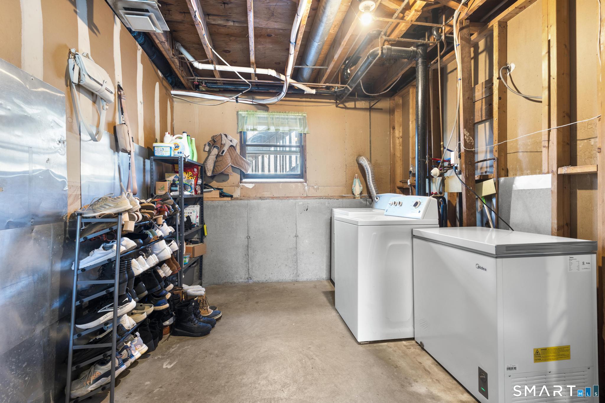 97 Racebrook Road Meriden, CT 06451 - Photo 23 of 35 a view of storage and utility room with washer and dryer
