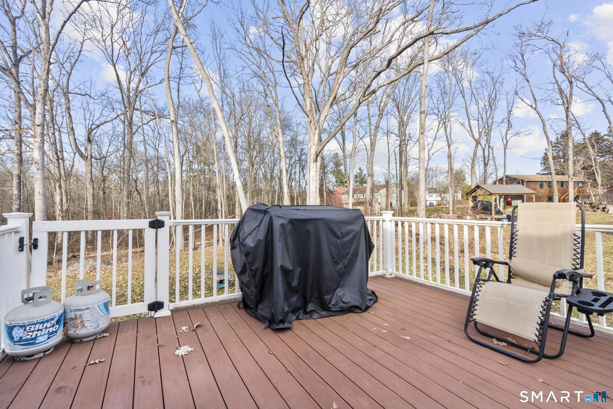 97 Racebrook Road Meriden, CT 06451 - Photo 29 of 35 a view of a deck with couches and wooden floor