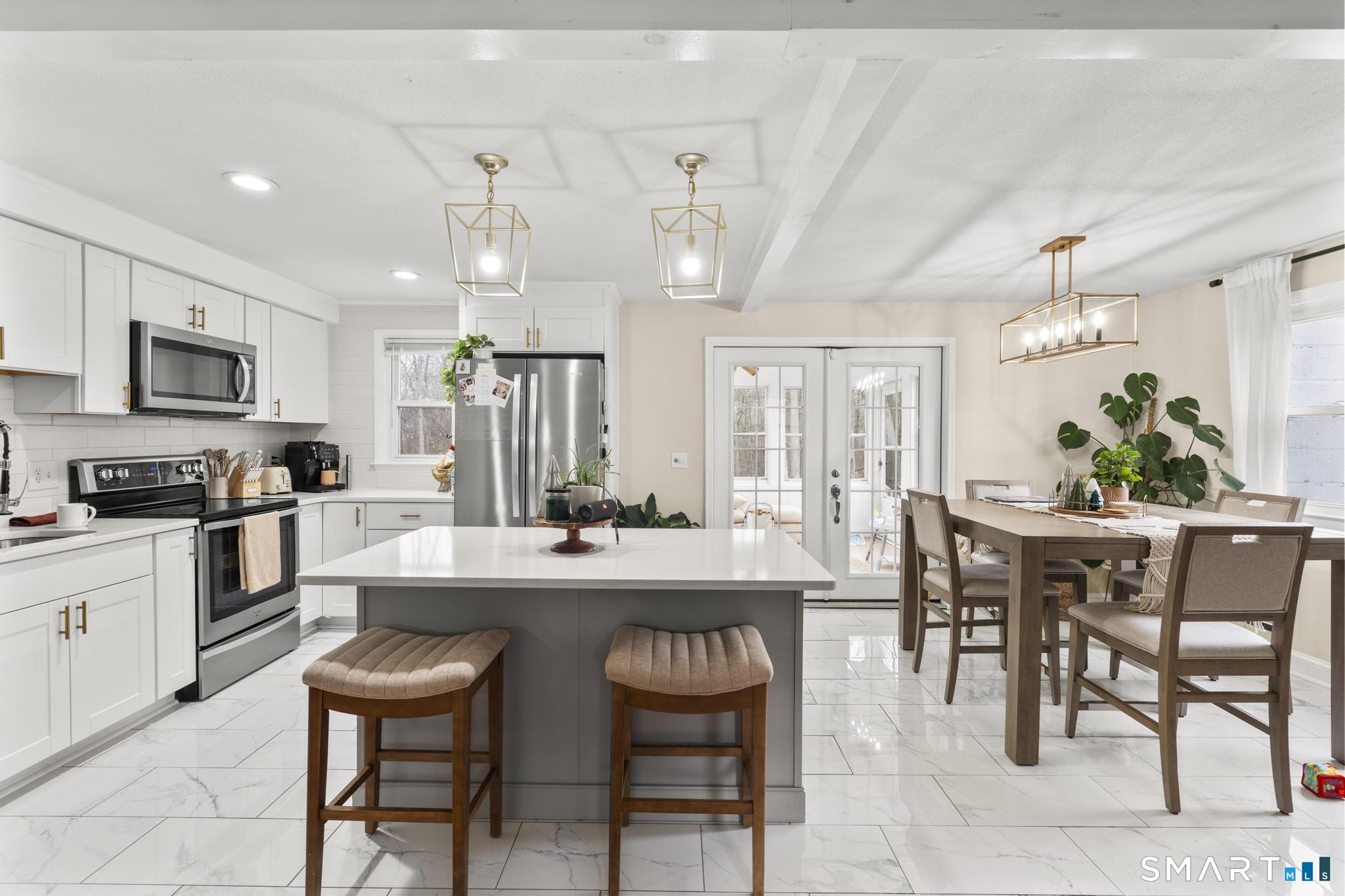 97 Racebrook Road Meriden, CT 06451 - Photo 5 of 35 a large kitchen with a table and chairs