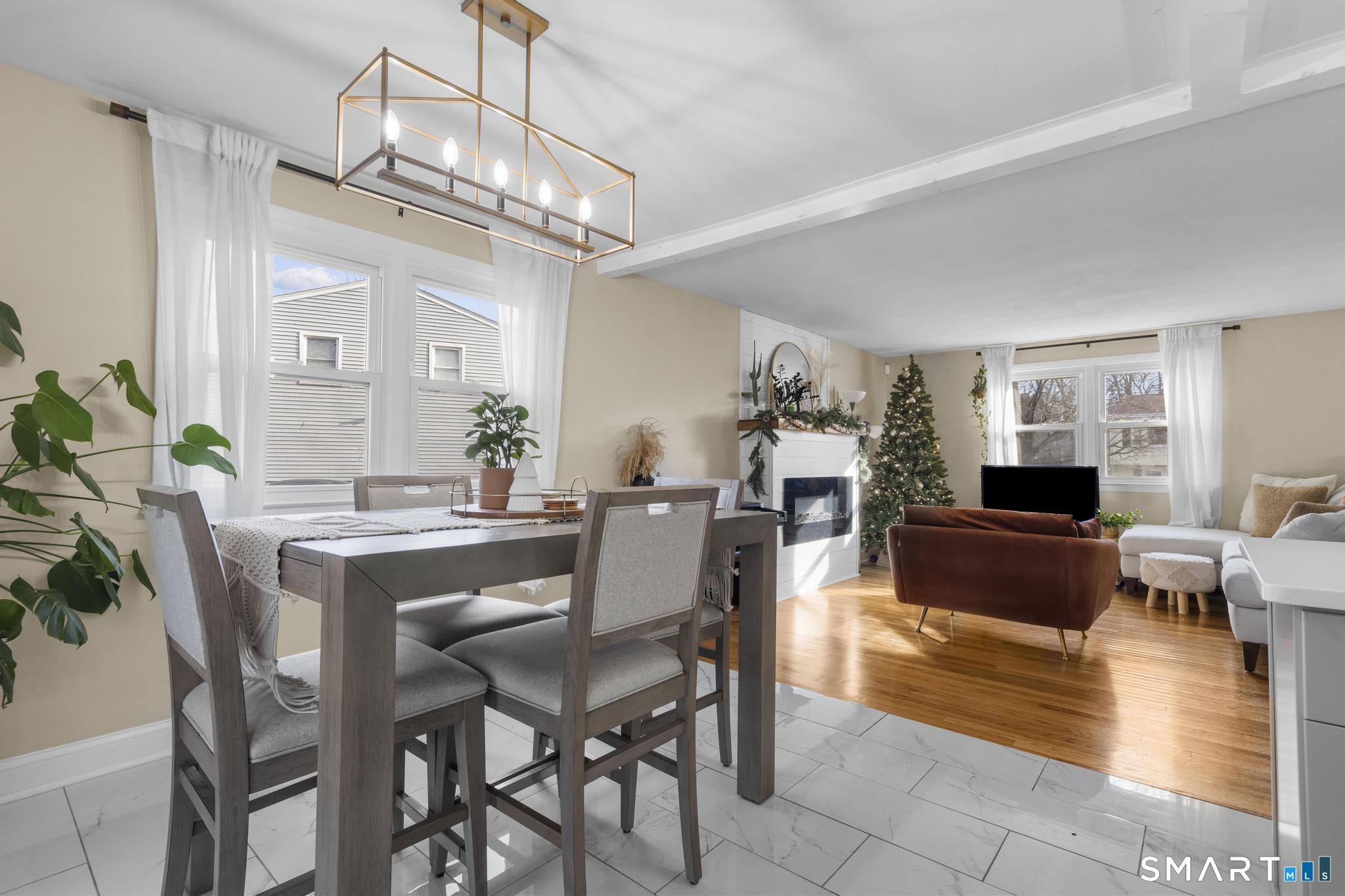 97 Racebrook Road Meriden, CT 06451 - Photo 6 of 35 a view of a dining room with furniture a chandelier and wooden floor