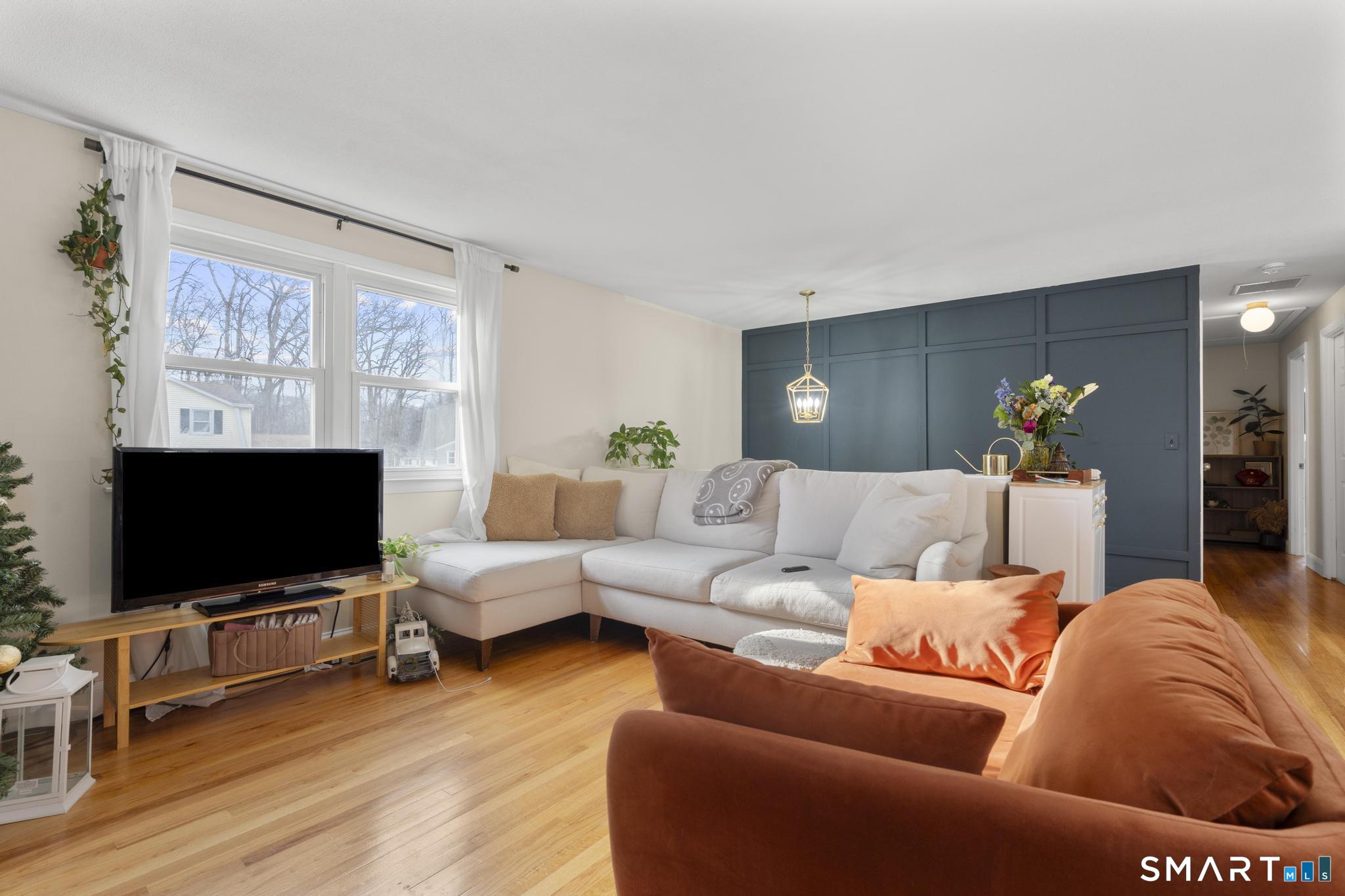 97 Racebrook Road Meriden, CT 06451 - Photo 7 of 35 a living room with furniture and a flat screen tv
