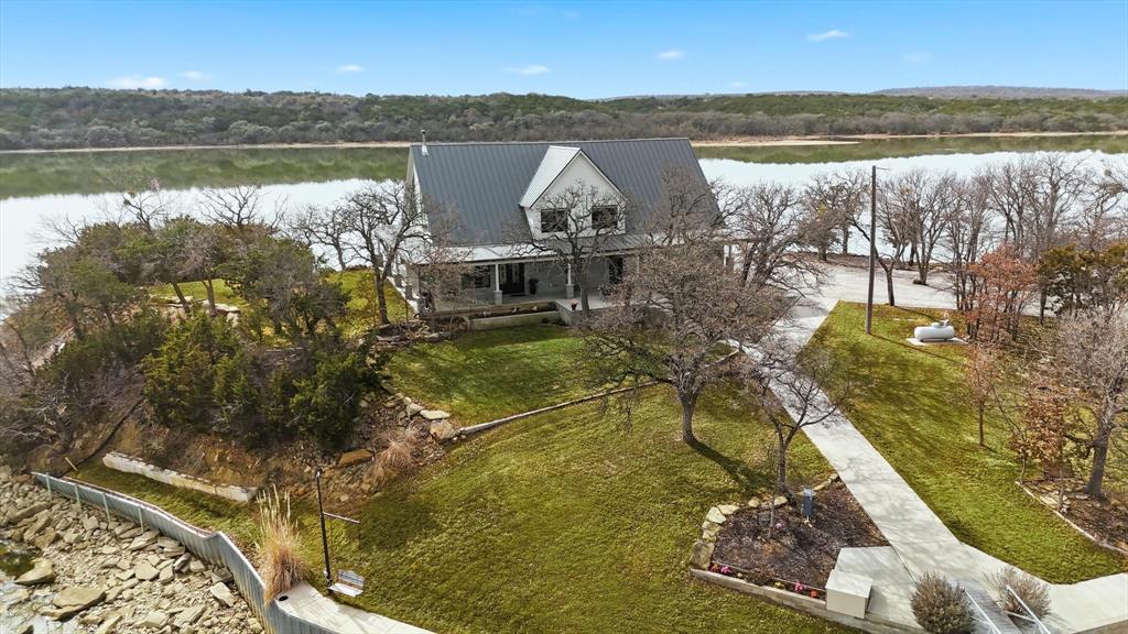 8799 County Road 299 Graham, TX 76450 - Photo 8 of 34 House and dock balance convenience and connection - easy access with full view of family fun on the water.