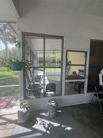 a view of a lobby with chair and floor to ceiling window