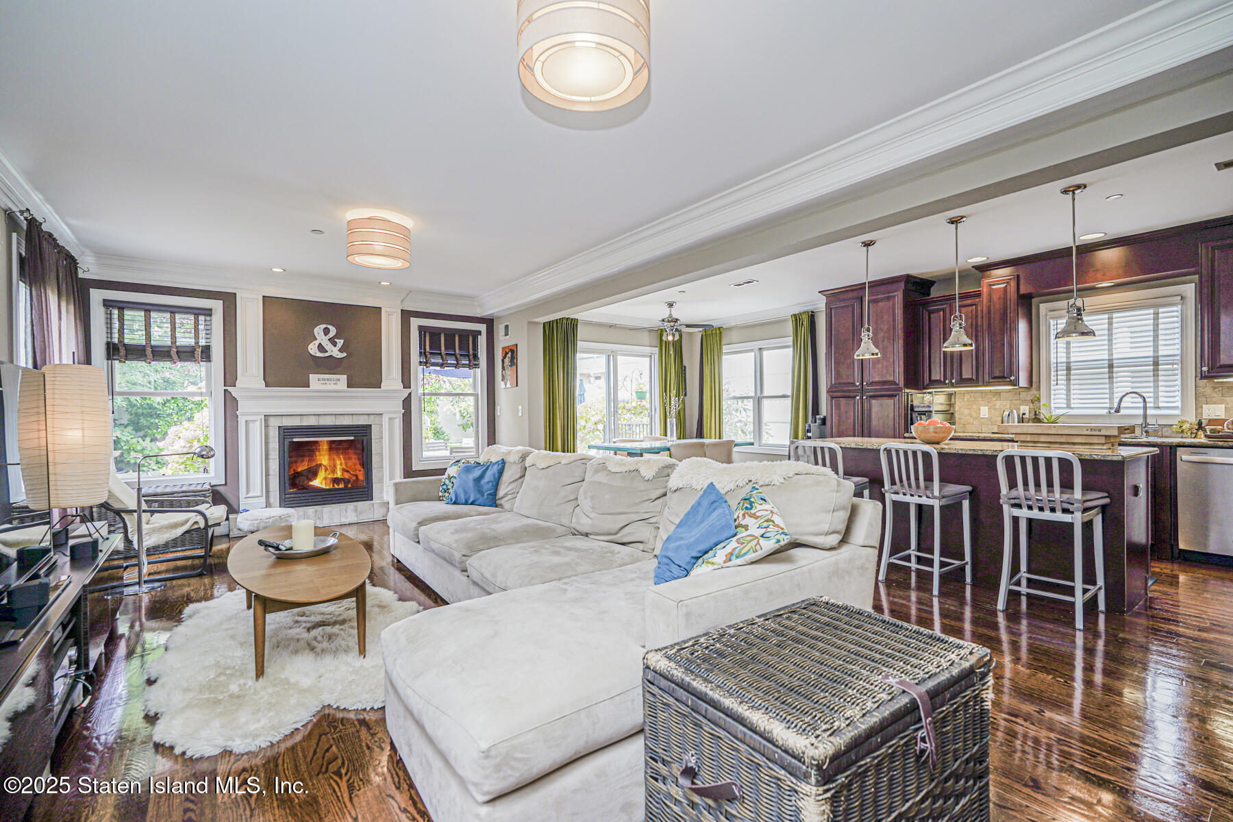28 Brookside Loop Staten Island, NY 10309 - Photo 11 of 60 a living room with furniture a flat screen tv and a fireplace