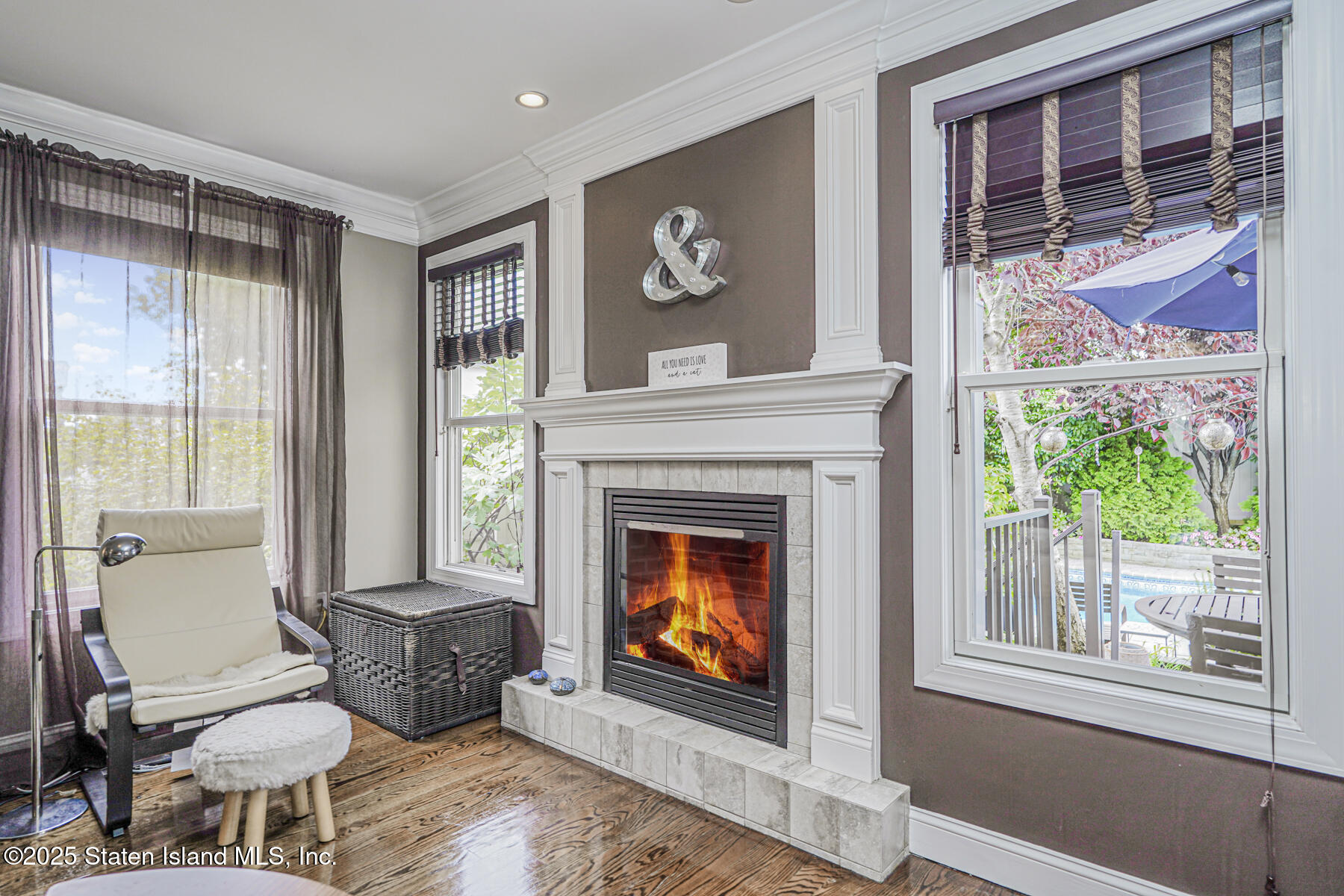 28 Brookside Loop Staten Island, NY 10309 - Photo 12 of 60 a living room with furniture and a fireplace