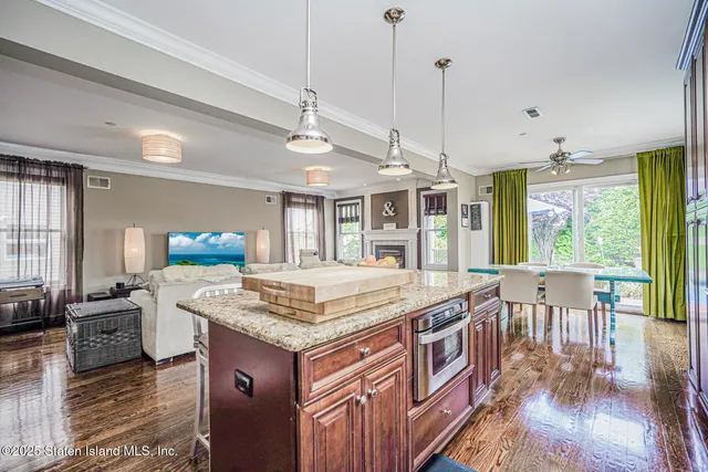 a view of a living room and a balcony