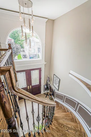a living room with furniture and a piano