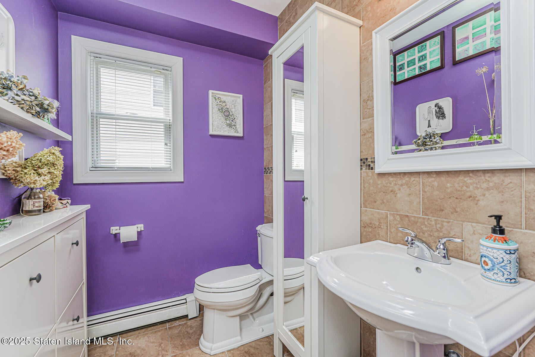 28 Brookside Loop Staten Island, NY 10309 - Photo 24 of 60 a bathroom with a sink a toilet and mirror