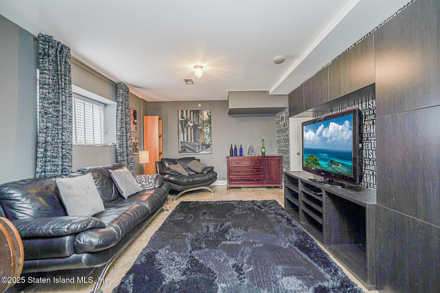 28 Brookside Loop Staten Island, NY 10309 - Photo 27 of 60 a living room with furniture and a flat screen tv