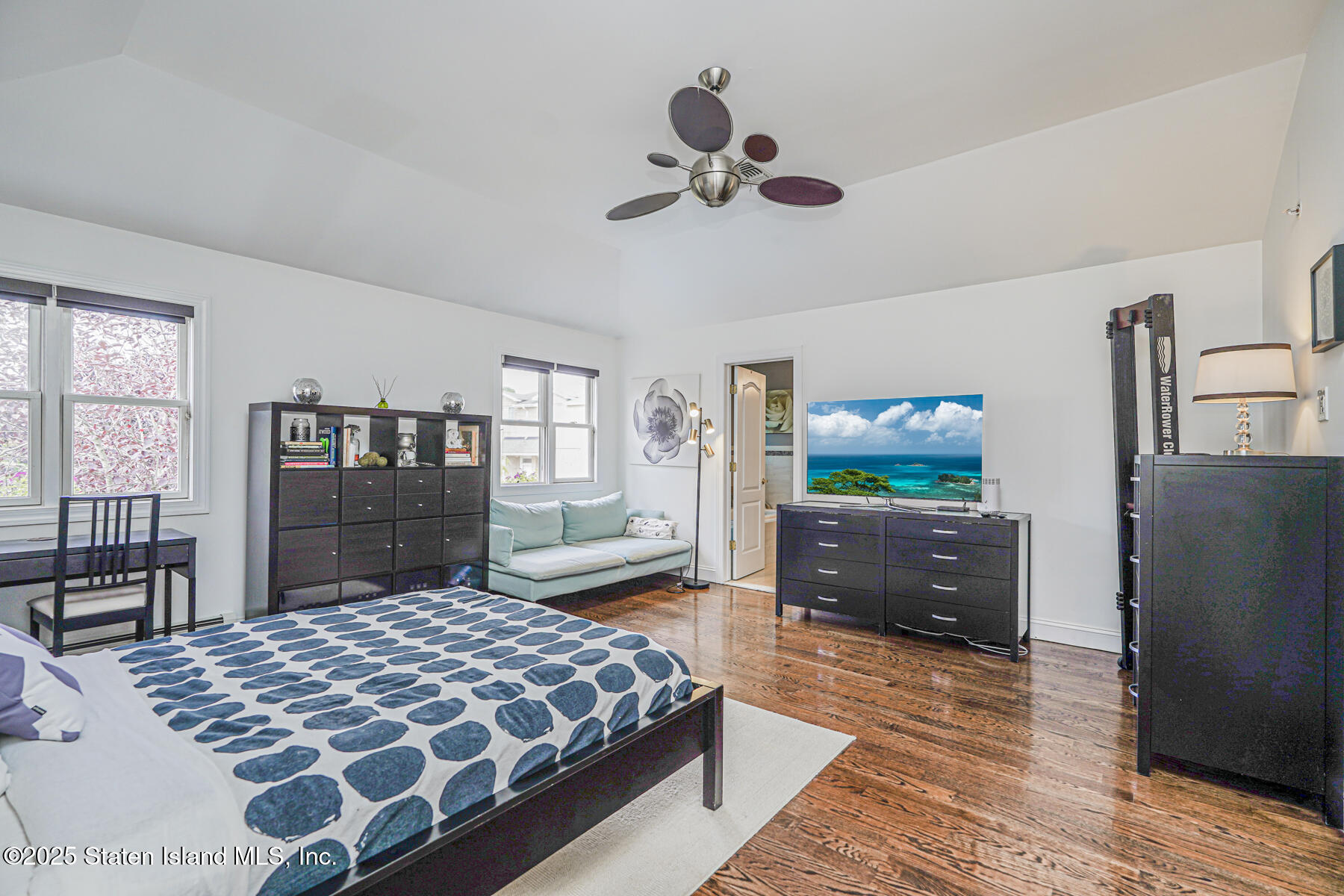28 Brookside Loop Staten Island, NY 10309 - Photo 29 of 60 a bedroom with a bed and dresser with mirror