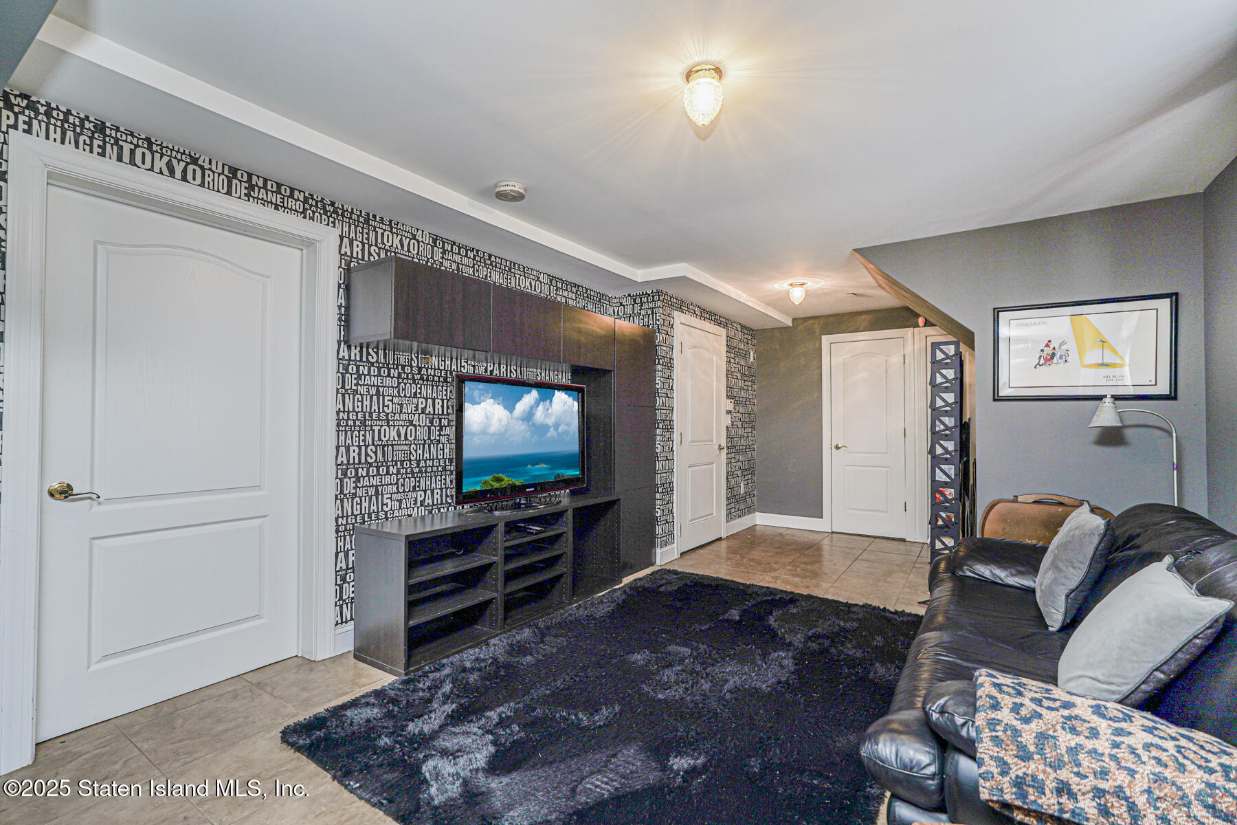 28 Brookside Loop Staten Island, NY 10309 - Photo 30 of 60 a living room with furniture and a flat screen tv