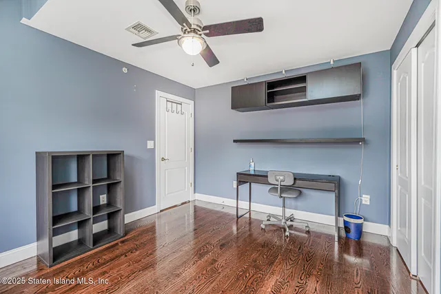 a bedroom with a bed dresser and a window