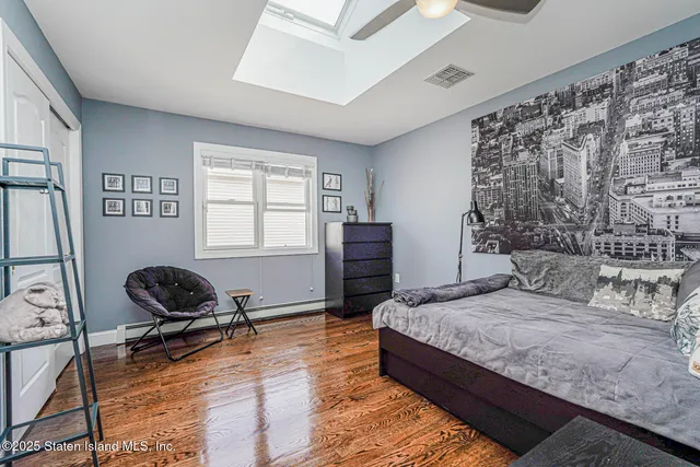 a view of walk in closet with clothes